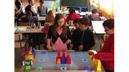 Les tables interactives comme outils éducatif dans les écoles. Ou comment associer le virtuel et le réel pour que les enfants travaillent de façon innée